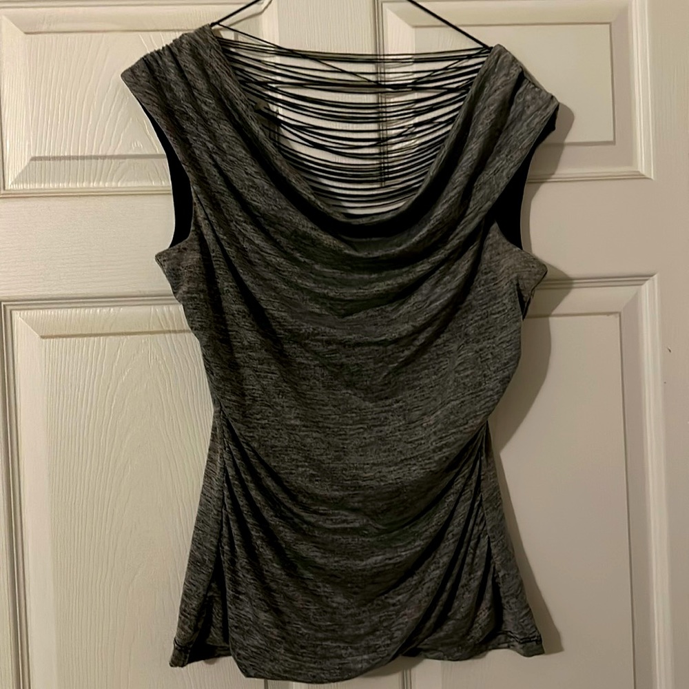 Grey open back blouse with black string across.  Drapes in the front.